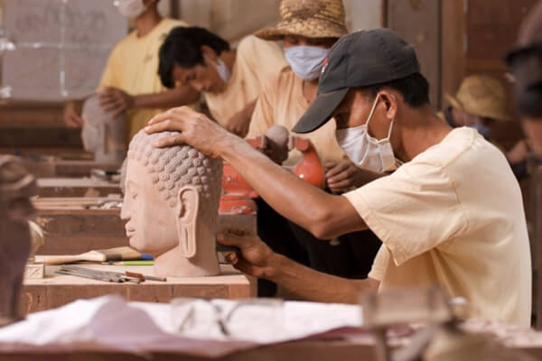 Artisan carving the buddha statue, Cambodia trips
