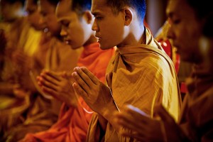 Buddhist monk pray for the death of people